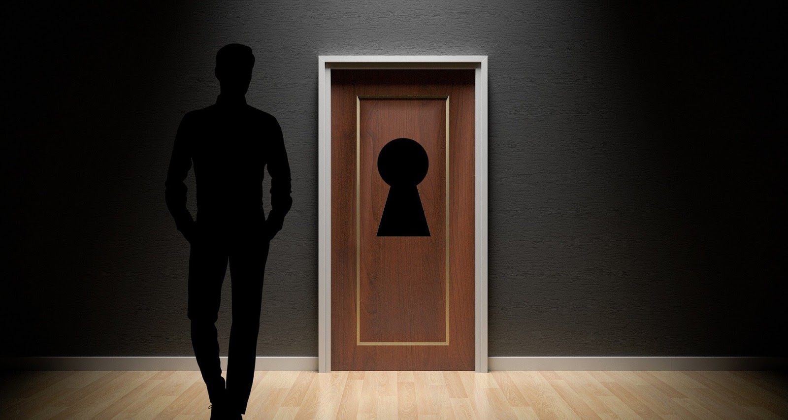 an image of a person's shadow standing in front of a door with a key hole