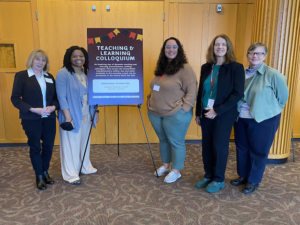 2023 LVAIC Teaching & Learning Colloquium Presenters standing with a sign for the event.