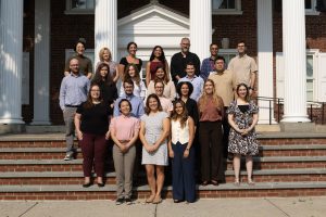 A group of new faculty members posing for a photo. 